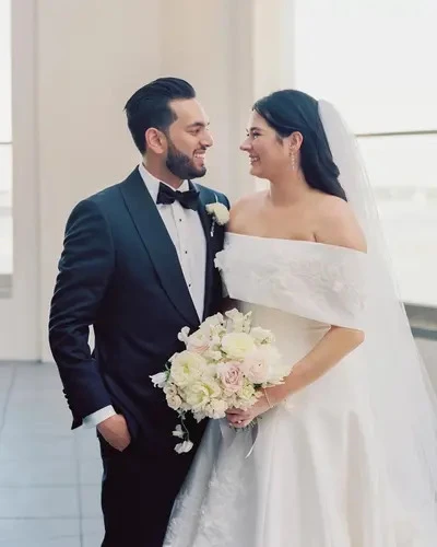 Real Bride Sophie + Sameer wedding picture in simple A-Line wedding dress.