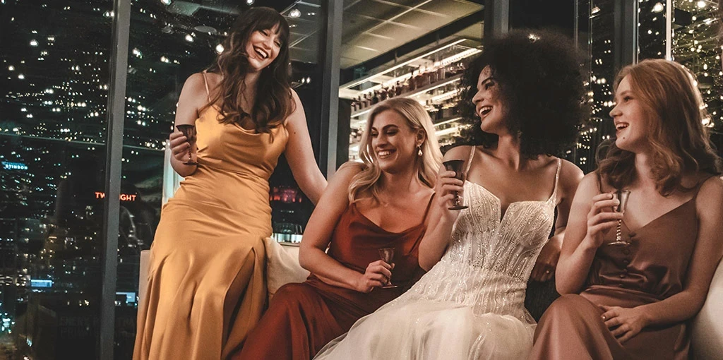 Bride laughing with wedding guests